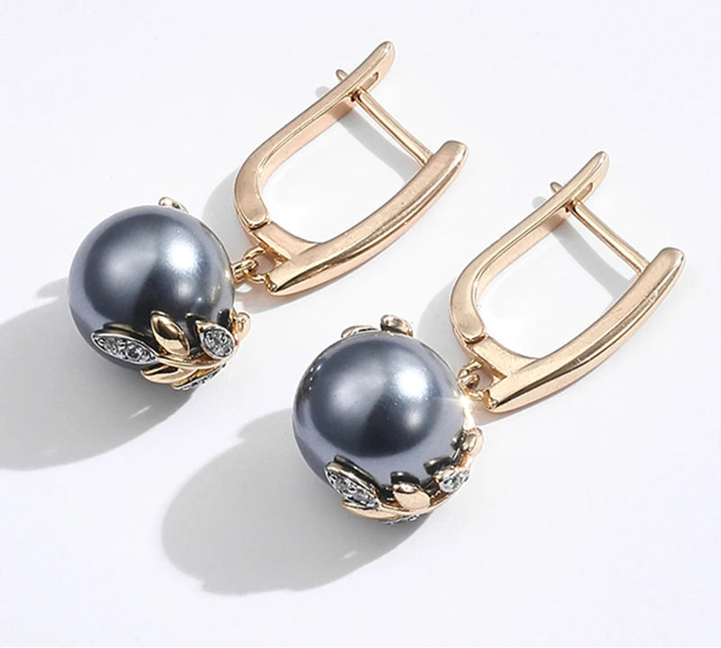 Sort Perle Øreringe med Gulddetalje